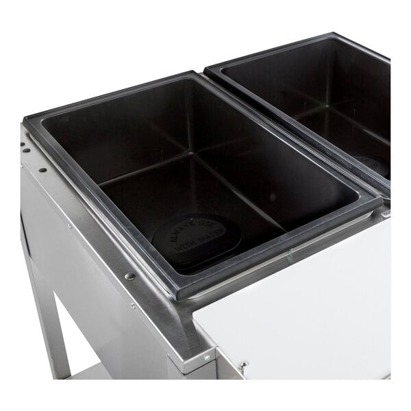 A stainless steel electric two pan hot food table with sealed wells.