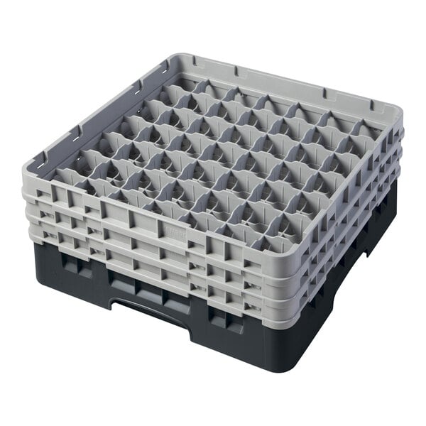 A black and gray plastic glass rack with 49 compartments for holding glasses.