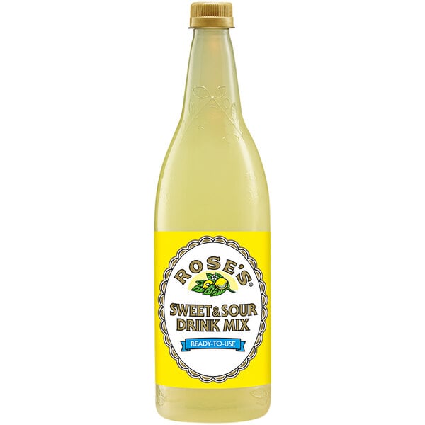 A bottle of Rose's Sweet and Sour Mix with a yellow label and yellow liquid inside.