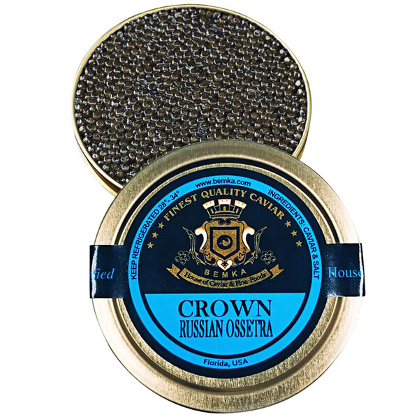 a close-up of a jar of black caviar