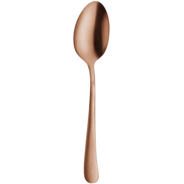 An Amefa Austin copper teaspoon with a long handle and spoon end.