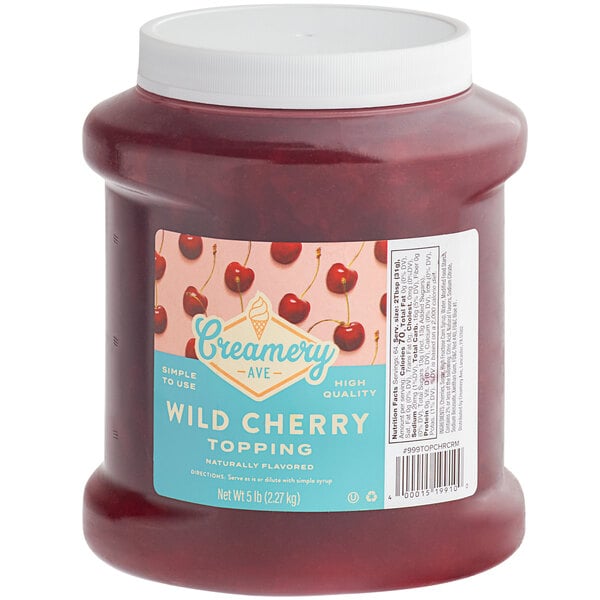 A jar of cherry topping with a white label.