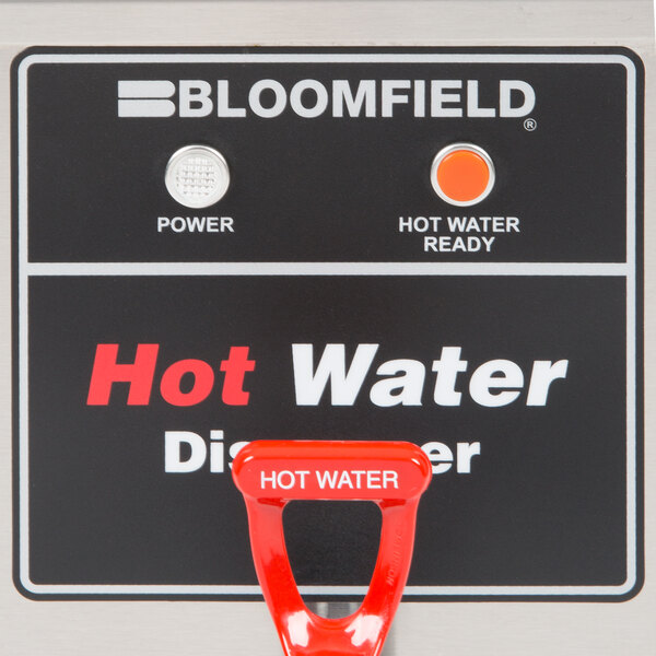 A Bloomfield hot water dispenser with a red handle and white text.