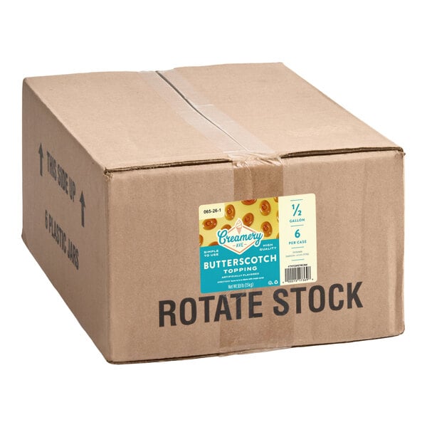 A cardboard box labeled 'Creamery Ave. Butterscotch Topping' containing six half-gallon containers.