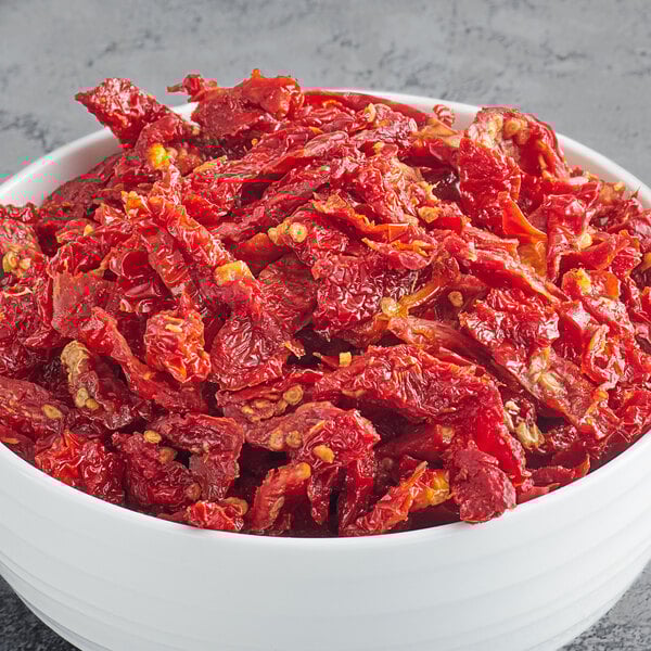 A white bowl of Del Destino sundried tomato strips.