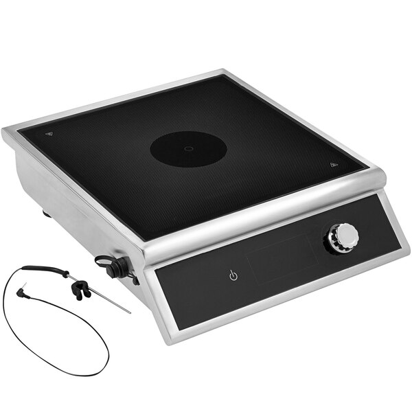 A silver and black Vollrath countertop induction range with a temperature control probe.