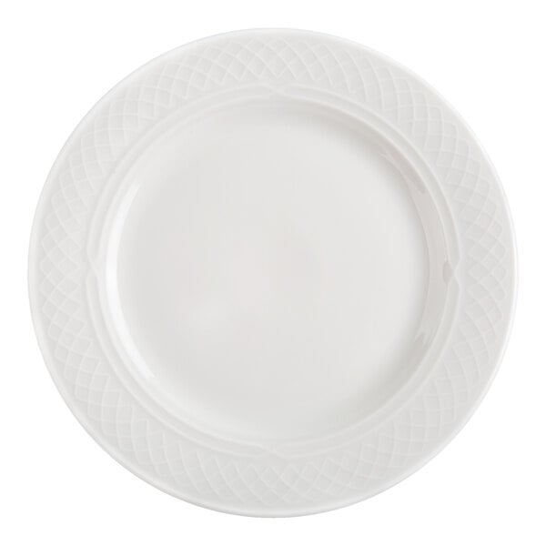 A round, bright white plate with a subtle textured pattern along the rim.