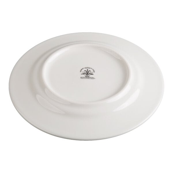 A white ceramic plate shown upside down, displaying a manufacturer's mark on the bottom center.