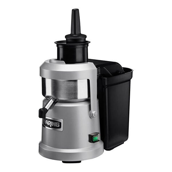 A silver and black Waring juice extractor.