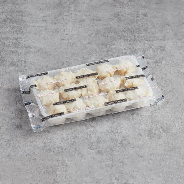 A plastic container of Passport Cuisine Shrimp Shumai.