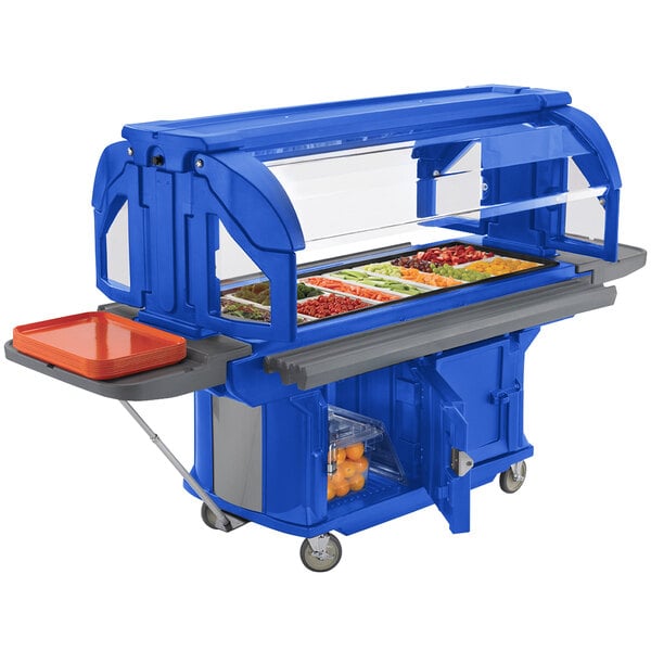 A navy blue food buffet with a tray of food on top.
