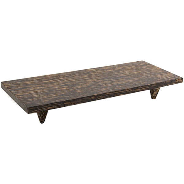 A rectangular wooden plate with legs on a table.