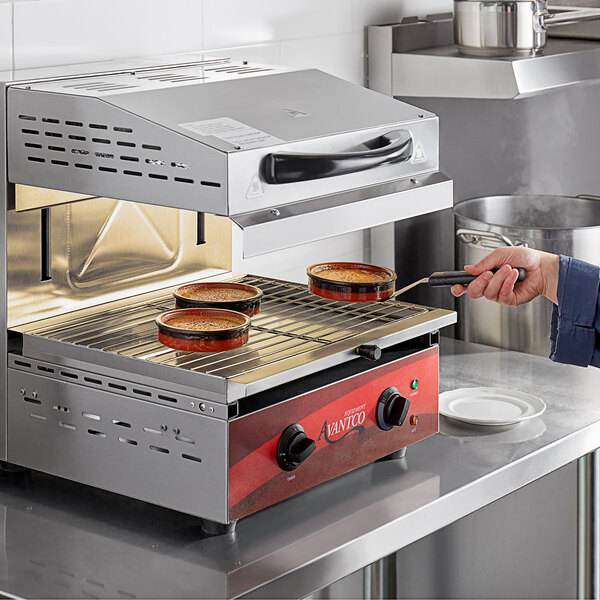 a hand holding a black handle