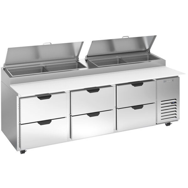 A Beverage-Air stainless steel refrigerated pizza prep table with drawers.