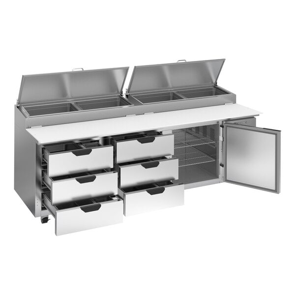 A large stainless steel refrigerated pizza prep table with six drawers, one door, and top compartments with lids.