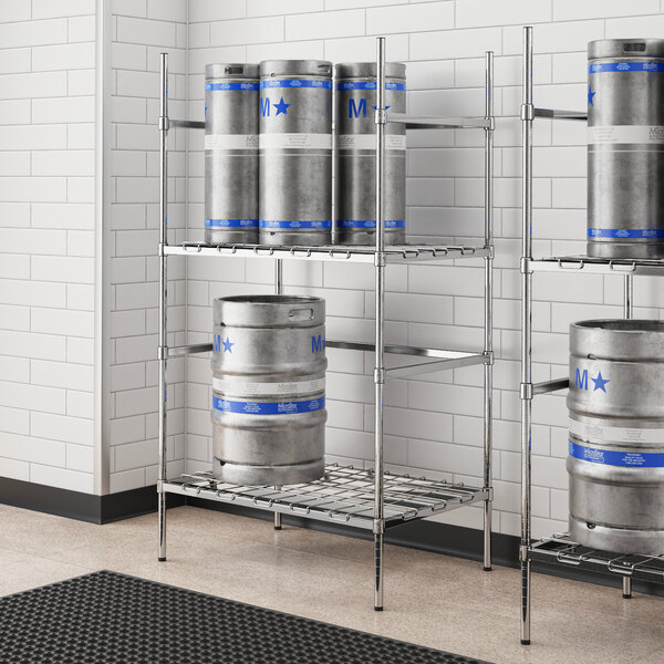 A metal shelf with kegs on it.