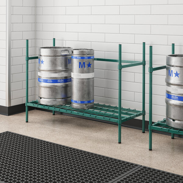 A group of metal kegs on a Regency metal keg rack.