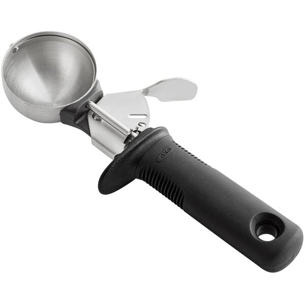 a metal scoop with a handle
