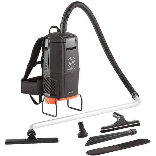 A close-up of a black Hoover HVRPWR 40V cordless backpack vacuum cleaner with tube and tools.
