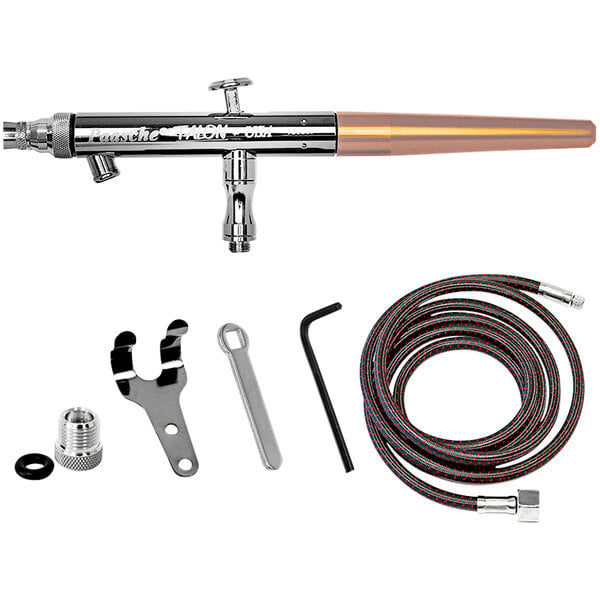 A Paasche airbrush set with a metal and copper tool.