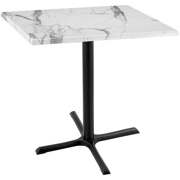 A white marble table with a black base.