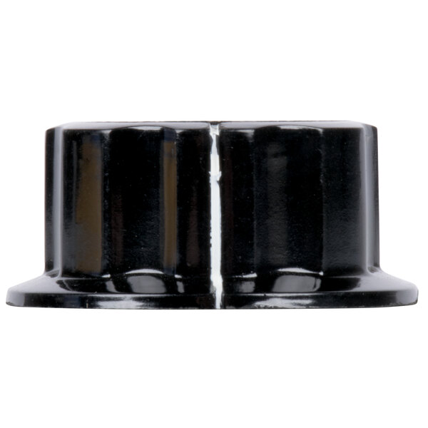 A black plastic control knob with white lines on a black nut.