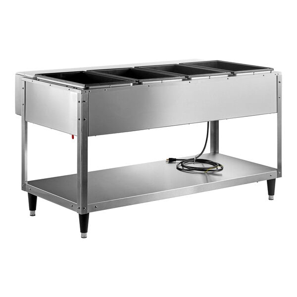A stainless steel Vollrath electric hot food table with sealed wells holding four trays.
