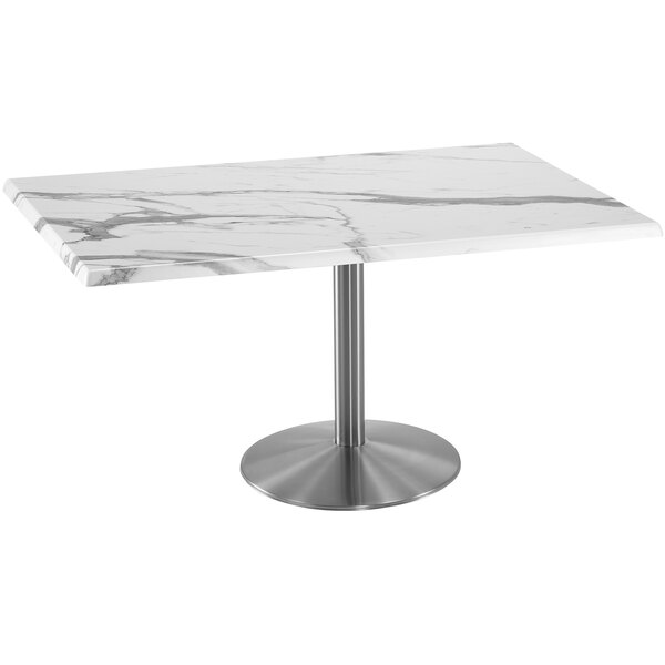 A white marble table with a stainless steel round base.