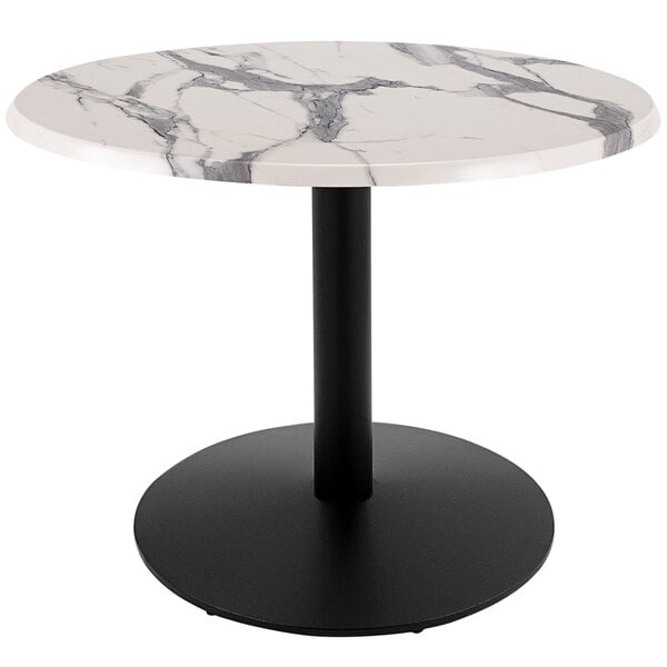 A white marble round table with a black round base.