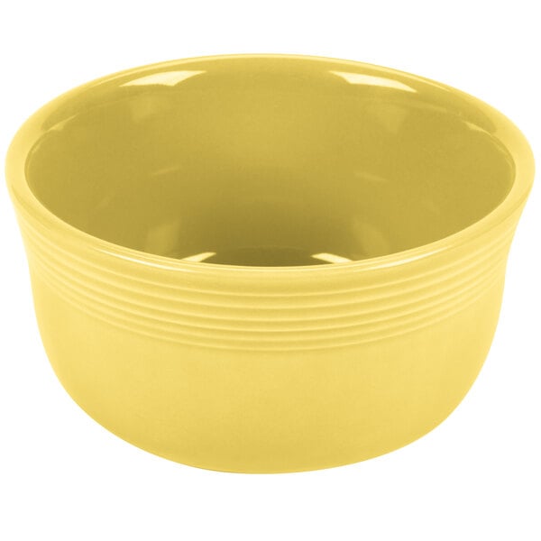 A close-up of a yellow Fiesta Gusto Bowl with a white background.