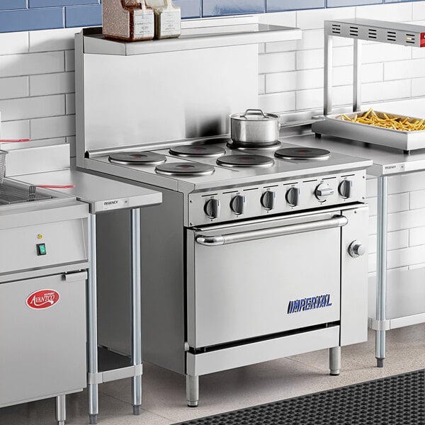 An Imperial Range commercial kitchen with an Imperial Range electric range and pots on the burners.