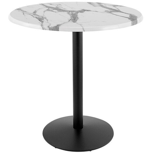 A round white marble table with a black round base.