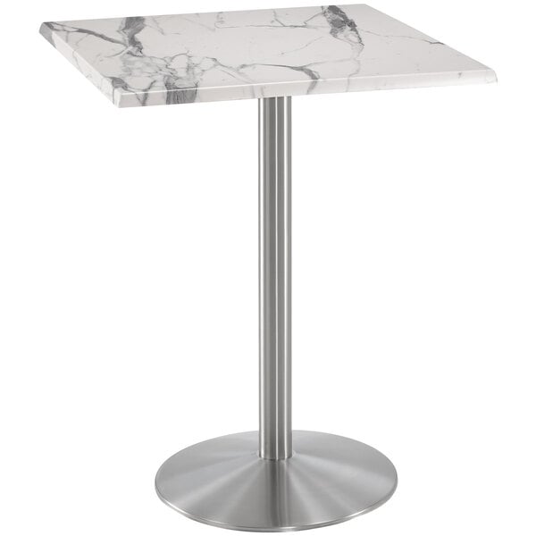 A white marble table with a stainless steel metal base.
