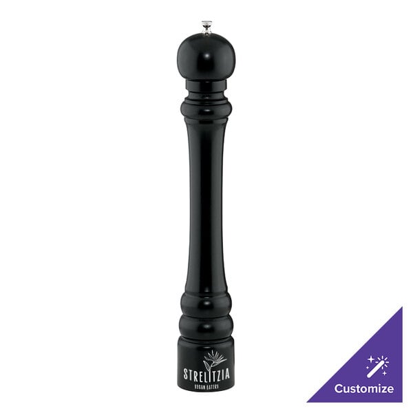 A black pepper mill with a white cap and a purple sticker.