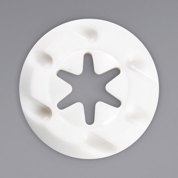 A white circular disc with a star cutout.