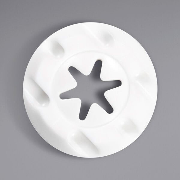 A white circular Carpigiani nozzle with a star cutout.