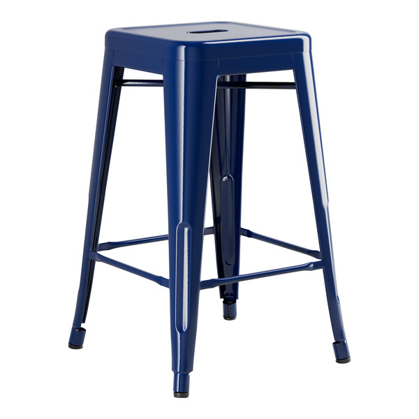 A blue metal Lancaster Table & Seating outdoor backless counter height stool with legs.