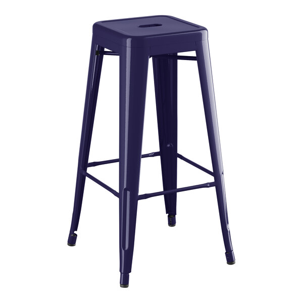 A blue metal Lancaster Table & Seating outdoor backless barstool with a metal seat.
