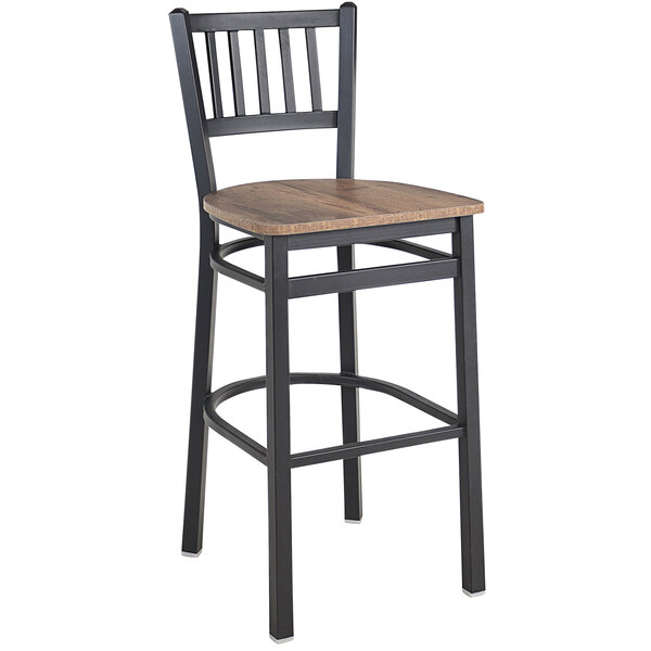 A BFM Seating black steel slat back barstool with a wood seat.