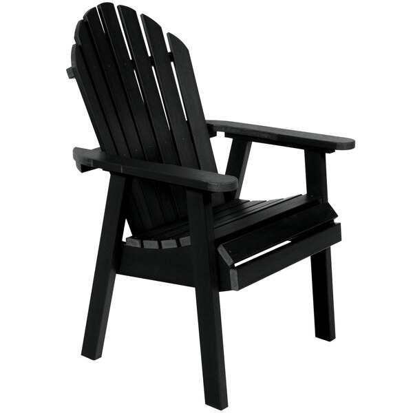 A black Sequoia faux wood Adirondack dining chair with armrests.