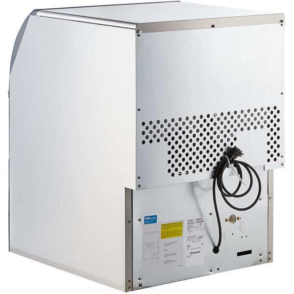 a white rectangular box with a black cord