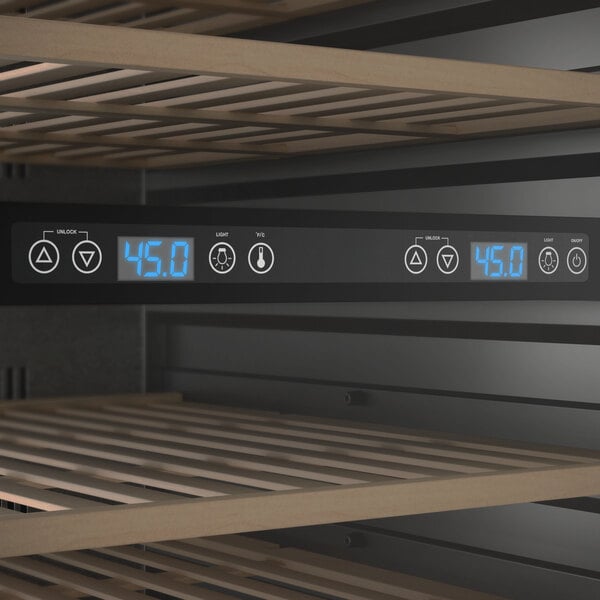 A dual temperature commercial wine cooler with digital controls and wooden shelves.