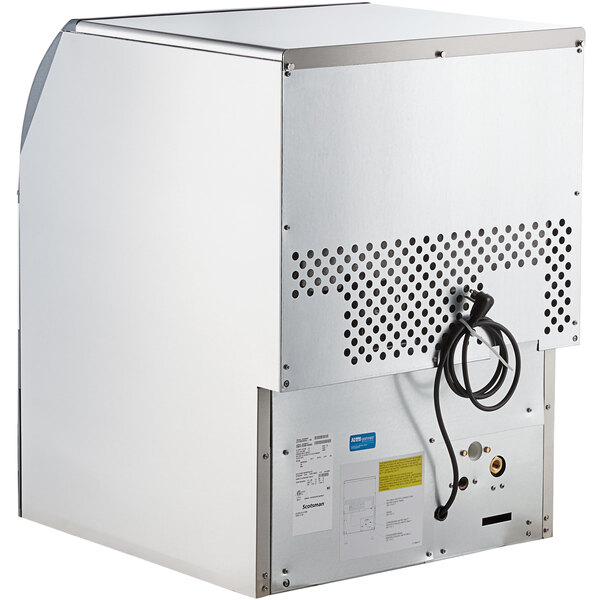 a white rectangular object with a black cord