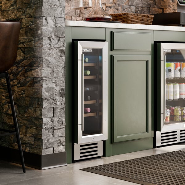 A dual temperature full glass door commercial wine cooler built into a kitchen cabinet.