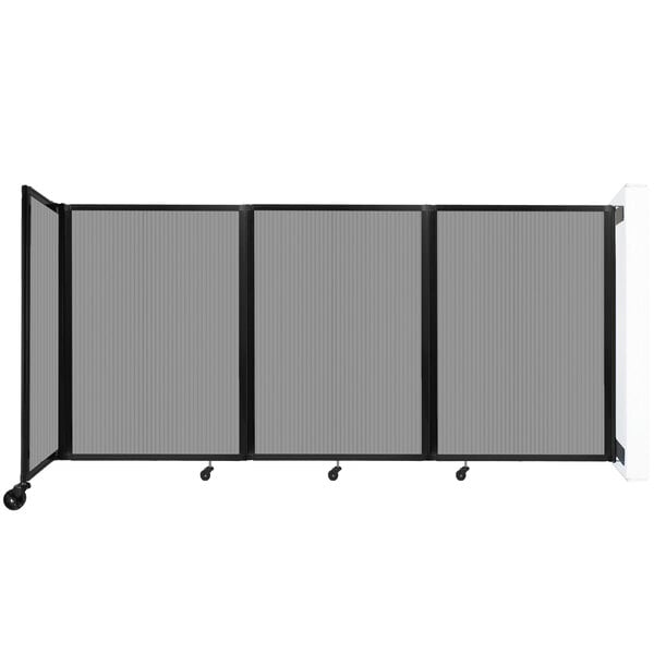 A light gray Versare wall-mounted room divider with black trim on wheels.