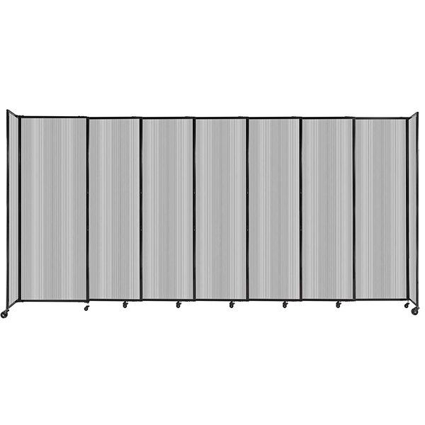 A clear poly room divider with wheels.