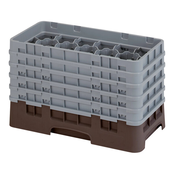 A stack of grey and brown plastic Cambro glass racks with extenders.