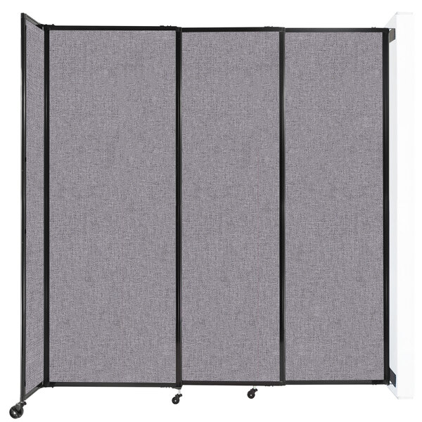 A Versare Cloud Gray StraightWall wall-mounted room divider with black wheels.