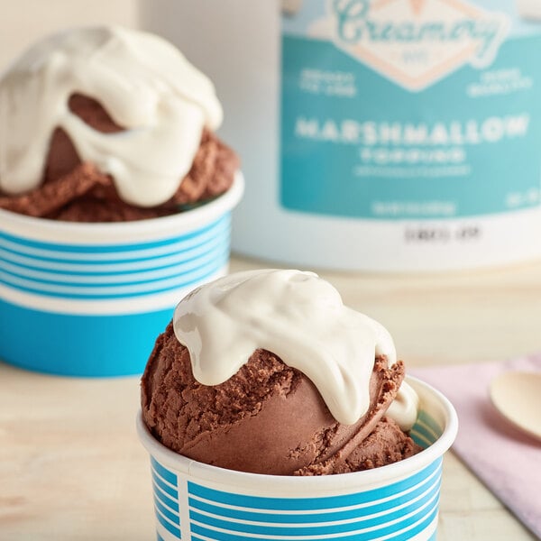 a cup of ice cream with a blue and white container