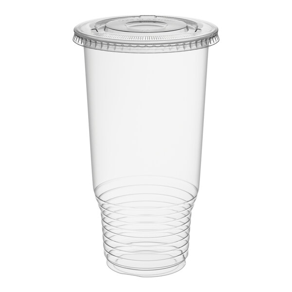 A clear 32 oz. heavy duty plastic cold cup with a flat lid.